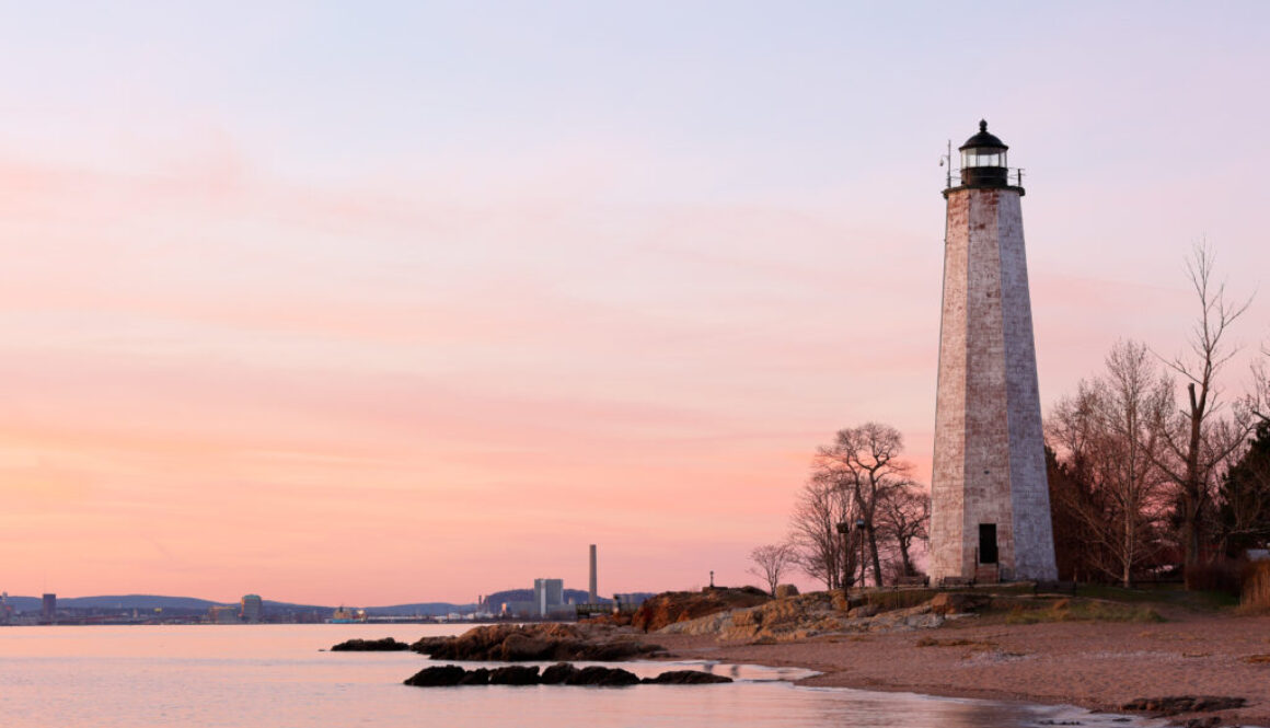 New Haven Light House at Lighthouse Point Park At Sunset. The lighthouse is dark, but the tower remains, greeting ships from around the world to New Haven.