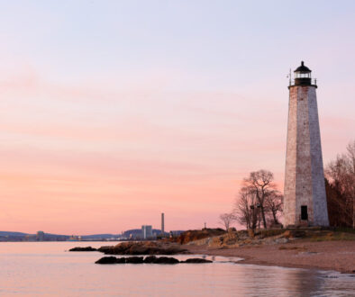 New Haven Light House at Lighthouse Point Park At Sunset. The lighthouse is dark, but the tower remains, greeting ships from around the world to New Haven.