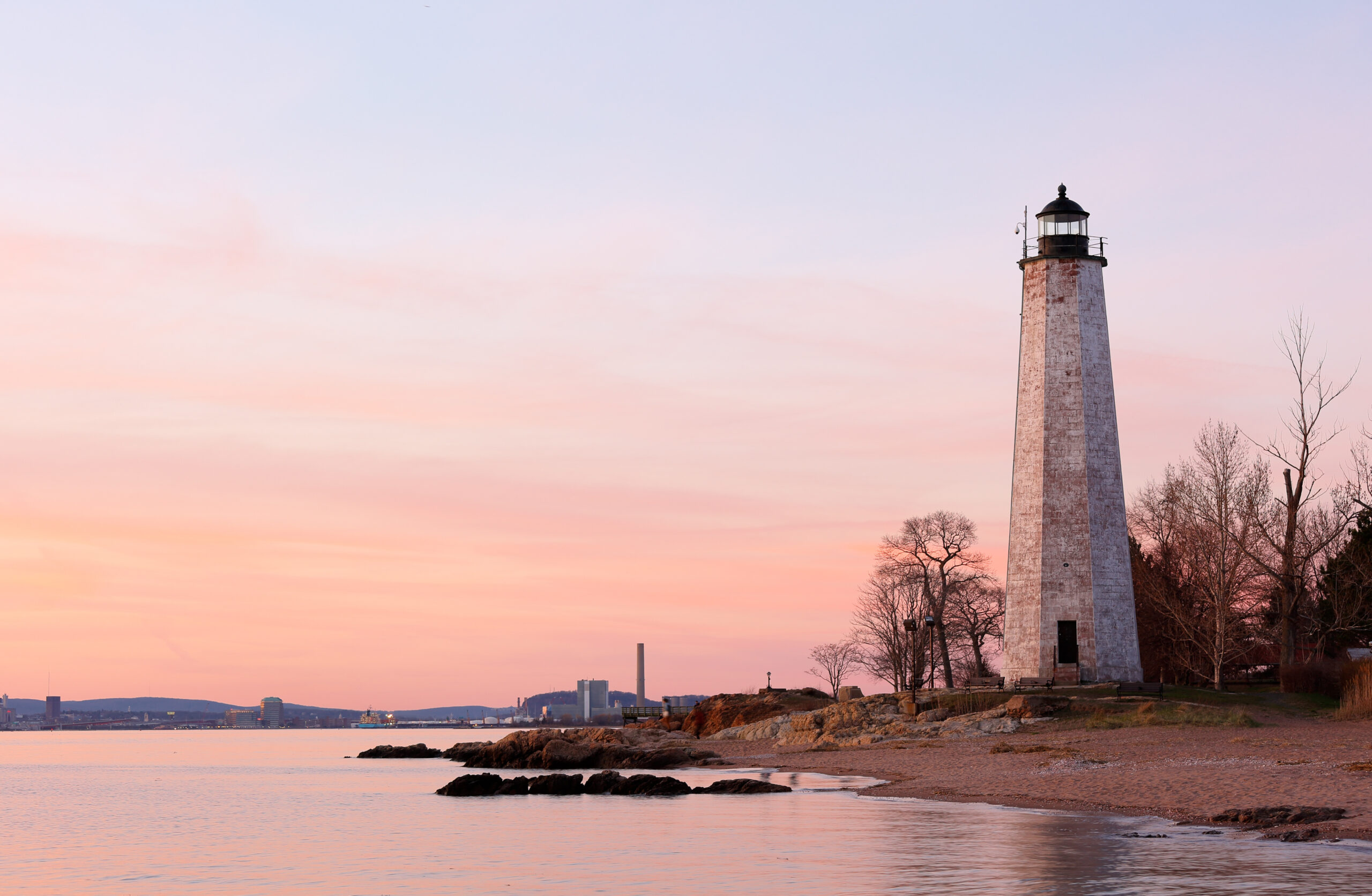New Haven Light House at Lighthouse Point Park At Sunset. The lighthouse is dark, but the tower remains, greeting ships from around the world to New Haven.